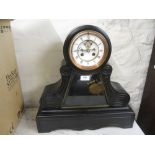 Large 19th Century black slate mantel clock having circular enamel dial with Roman numerals and