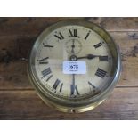 20th Century brass cased ships clock with painted metal dial having Roman numerals and single train