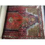 Small Hamadan rug with lobed medallion and all-over stylised floral design on a red / blue ground