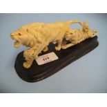 Late 19th or early 20th Century Japanese carved ivory group of a lion and three tigers with glass