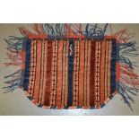 Yomut Turkoman saddle rug with fringed border,