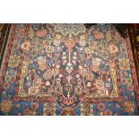 Turkoman rug of centre medallion and all-over floral design with floral borders,