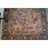 Indo Persian rug with all-over stylised floral design on a fawn ground with borders,