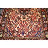 Hamadan rug of centre medallion and all-over floral design with floral borders,