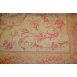 Laura Ashley machine made rug having floral design on pink ground,