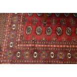 Pakistan Bokhara design runner and a similar rug