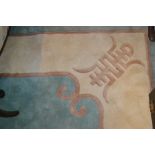 Chinese carpet with single medallion design on a turquoise ground with cream borders,