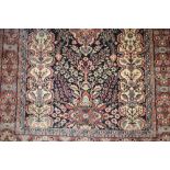 Small Indo Persian rug with floral design on beige ground with borders together with a modern rug