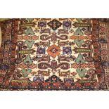 Indo Persian rug of Shirvan design with an ivory ground and multiple borders,