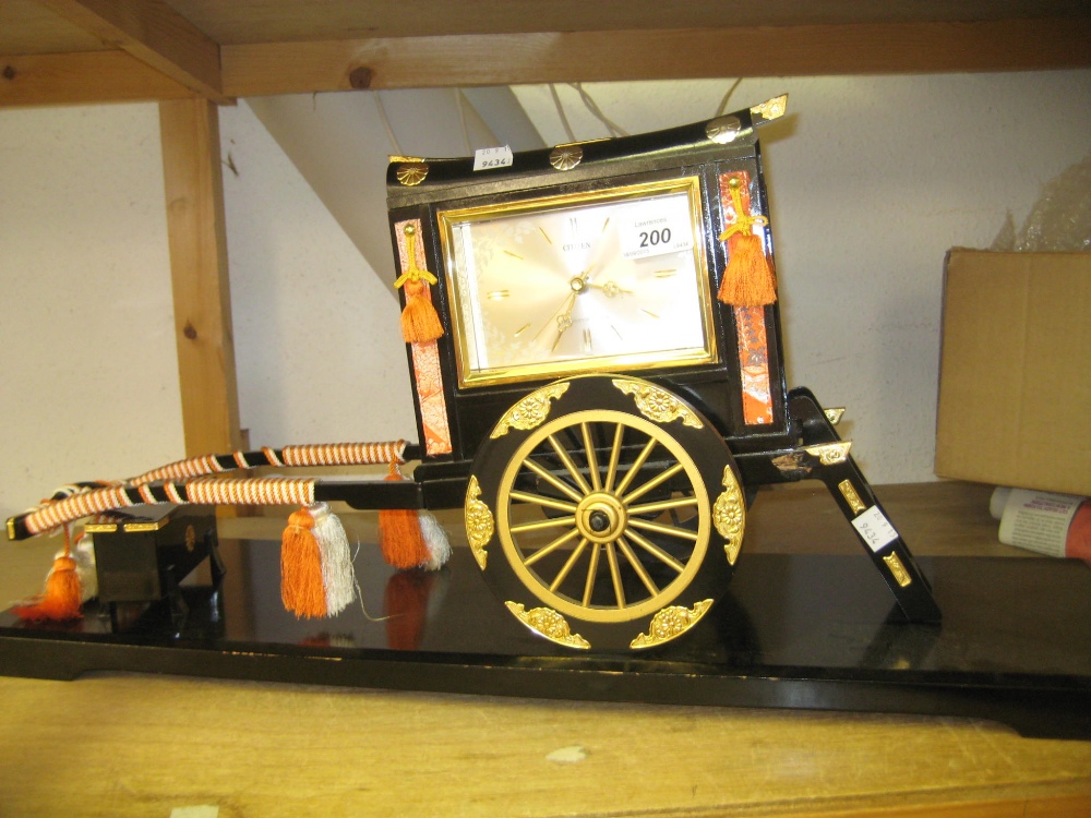Modern oriental lacquer model of a tuk tuk mounted with a Citizen clock