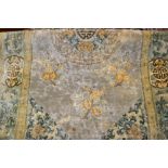 Chinese rug with medallion and floral design together with a machine made Persian pattern rug