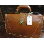 Ladies brown leather handbag in the form of a small briefcase