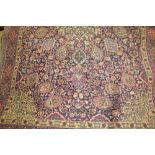 Tabriz rug with medallion and vase and all-over floral design on a midnight blue ground with