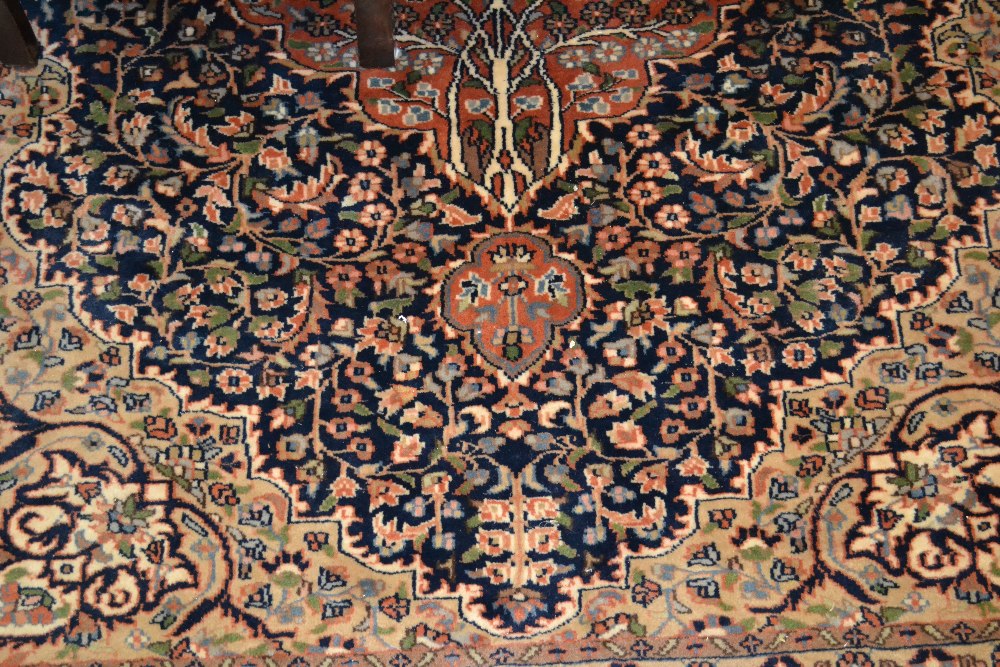 Indo Persian rug with medallion and all-over stylised floral design in shades of pink,