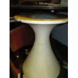 Late 20th Century circular table on moulded conical resin base together with a set of six orange