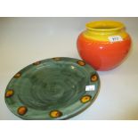 Pottery green glazed shallow bowl and an Art Pottery orange and yellow glazed bulbous form vase