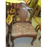 Pair of 20th Century walnut open elbow chairs with drop-in seats,