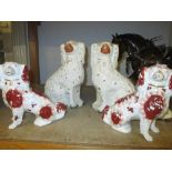 Two pairs of 19th Century Staffordshire figures of seated spaniels