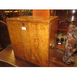 Large 19th Century burr walnut table top cabinet having flush brass side carrying handles and two