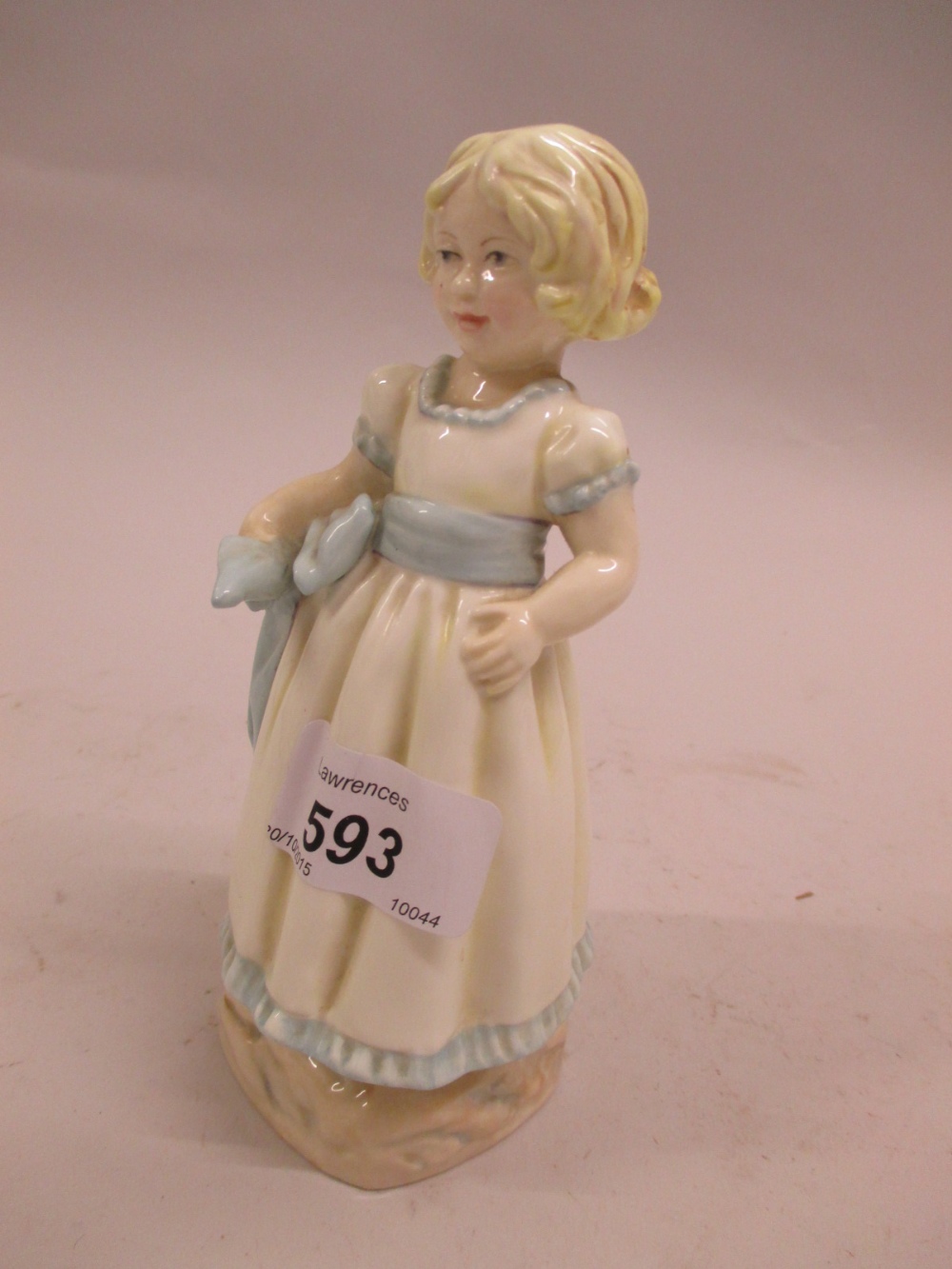 Royal Worcester porcelain figure of a girl in white dress with blue ribbon