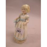 Royal Worcester porcelain figure of a girl in white dress with blue ribbon