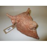 Small excavated terracotta wall plaque in the form of a Minoan bull (damages and repairs)