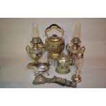 Pair of silver plated pedestal oil lamps with embossed decoration,
