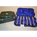 Cased set of six silver handled tea knives, a cased set of six plated tea knives,