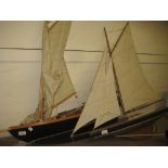 Large late 20th Century model pond yacht with sails together with another similar smaller (both