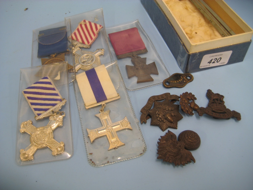 Five various copy medals and a small quantity of cap badges etc