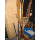 Miscellaneous sporting related items including cricket bat, hockey sticks, fishing rods,