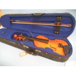 Modern violin with bow in a fitted case