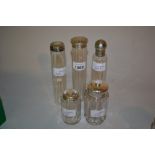 Five various silver mounted cut glass dressing table bottles