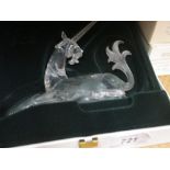 Three similar Swarovski figures of a dragon,