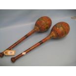 Pair of painted and turned wooden training clubs with various crests dated 1892