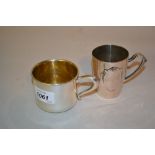 Sterling silver mug of plain design with loop handle together with a Continental (800 mark) mug