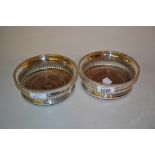 Pair of George III circular silver and wooden bottle coasters, London,
