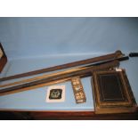 Two early 20th Century snooker cues in cases, part set of bone and ebony dominoes,