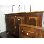 Good quality reproduction mahogany and crossbanded breakfront side cabinet with four panel doors,