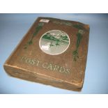 An album containing a collection of early 20th Century postcards