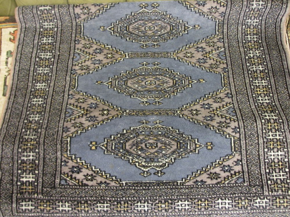 Small Pakistan rug with central hooked medallions and multiple borders