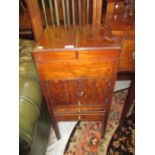 19th Century mahogany washstand with hinged cover enclosing fitted bowl above two doors and two