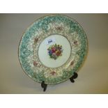 Royal Worcester wall plate painted with flowers with green and gilded borders