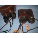 Two cased pairs of binoculars