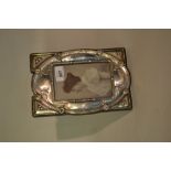 Birmingham silver photograph frame of an embossed stylised design on a wooden backing (slight