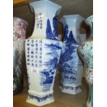 Pair of Chinese blue and white hexagonal form vases decorated with landscapes