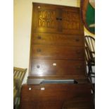 20th Century oak side cabinet having two carved panelled doors above three drawers with knob