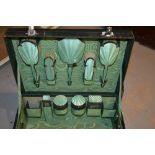 Birmingham silver and green enamel travel dressing set comprising  fifteen pieces in original green