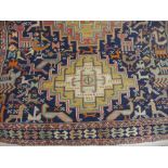 Soumak rug with repeating hooked medallion design on blue ground with borders (a/f)