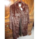 Ladies three quarter length fur coat with label for Hickleys,